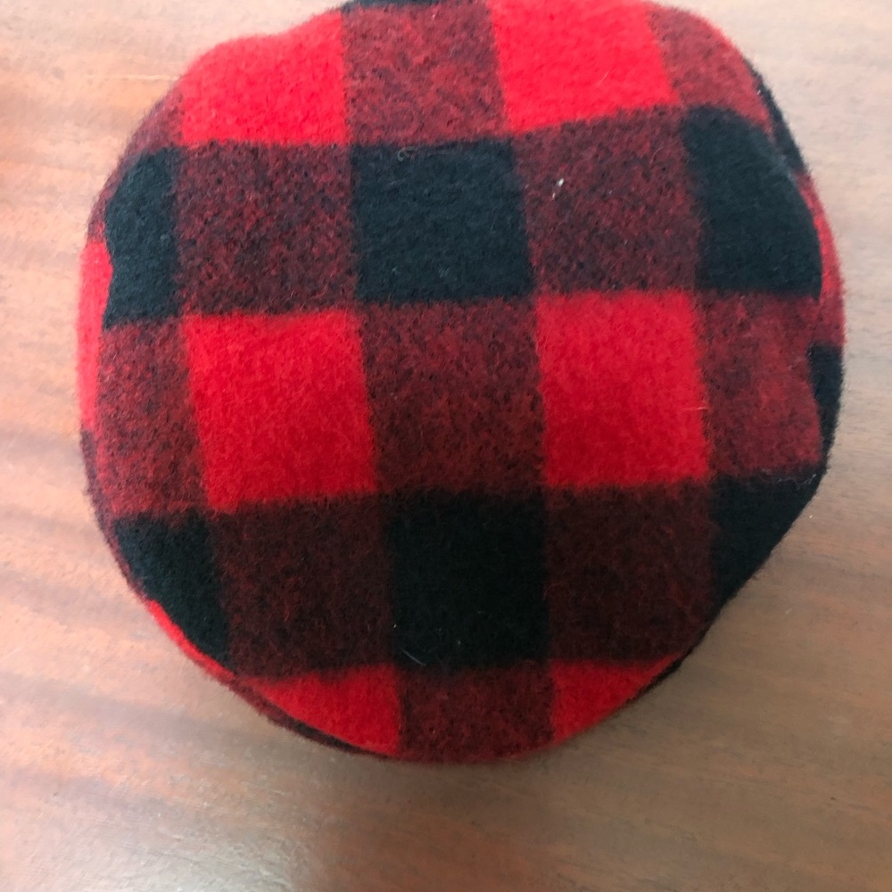 Red and black checked man’s hat